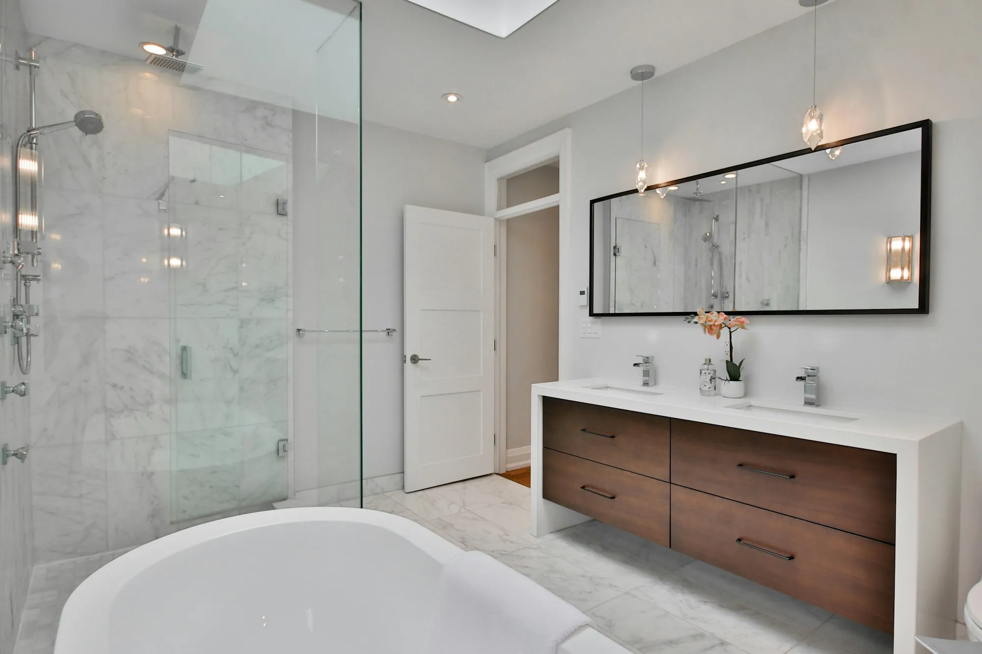 Renovated bathroom with tile and a vanity